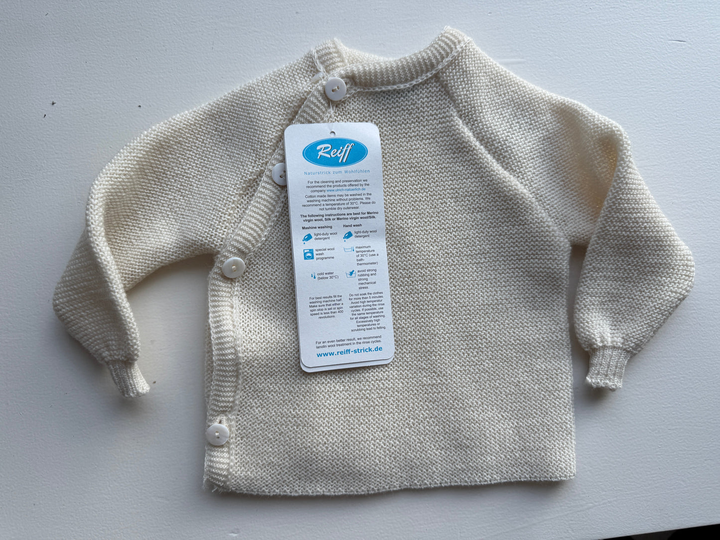 Baby Wolle Strickjacke Merino Schlüttli natur