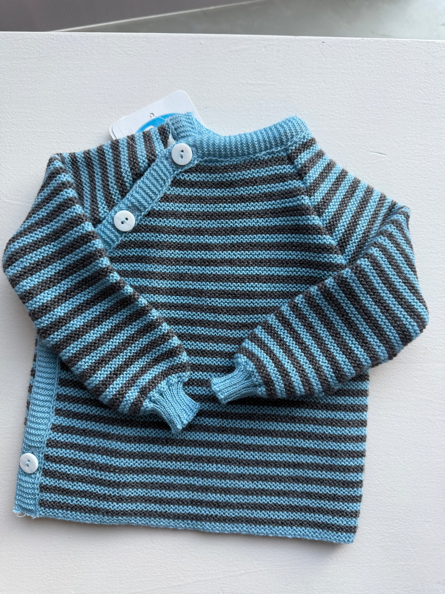 Baby Wolle Strickjacke Merino Schlüttli lagune-fels